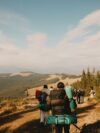 A group of people hiking up a hill