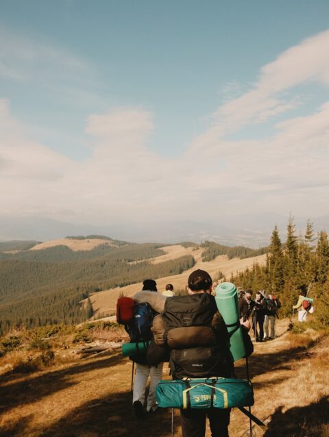 A group of people hiking up a hill