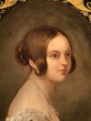 woman with brown hair painting