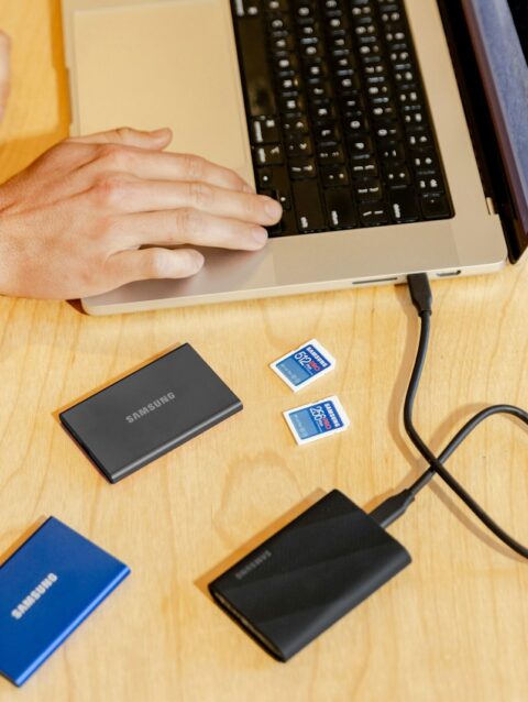 A person sitting at a table with a laptop