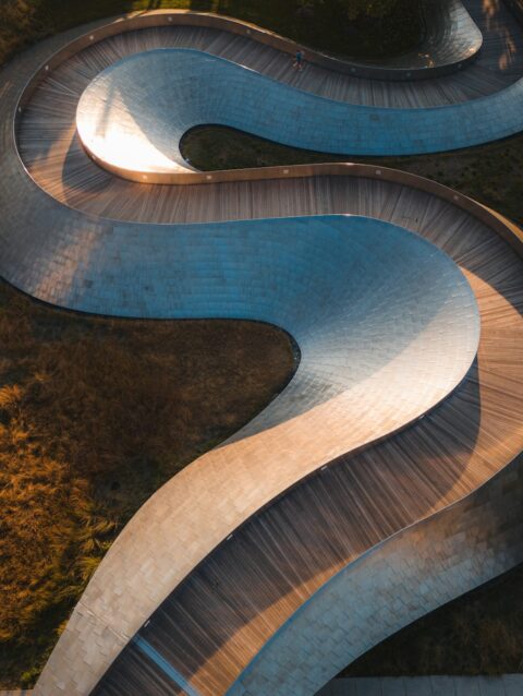 An aerial view of a curved road