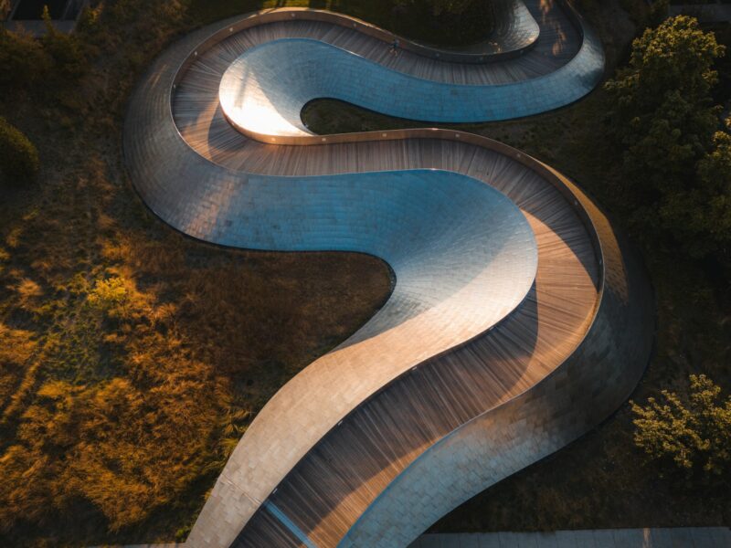 An aerial view of a curved road
