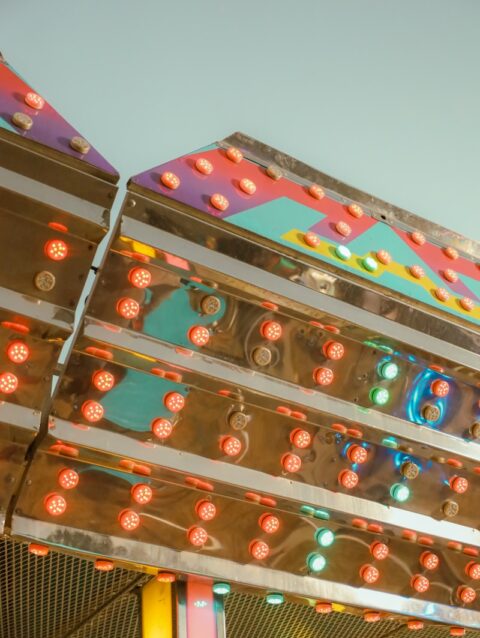 A carnival ride with a lot of lights on top of it