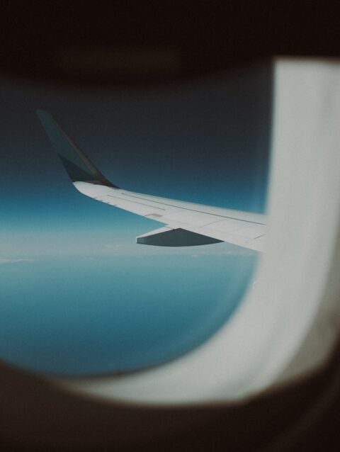 A view of the wing of an airplane in the sky