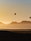 A group of hot air balloons flying in the sky