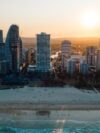 An aerial view of a city at sunset