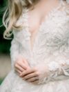 A close up of a person wearing a wedding dress